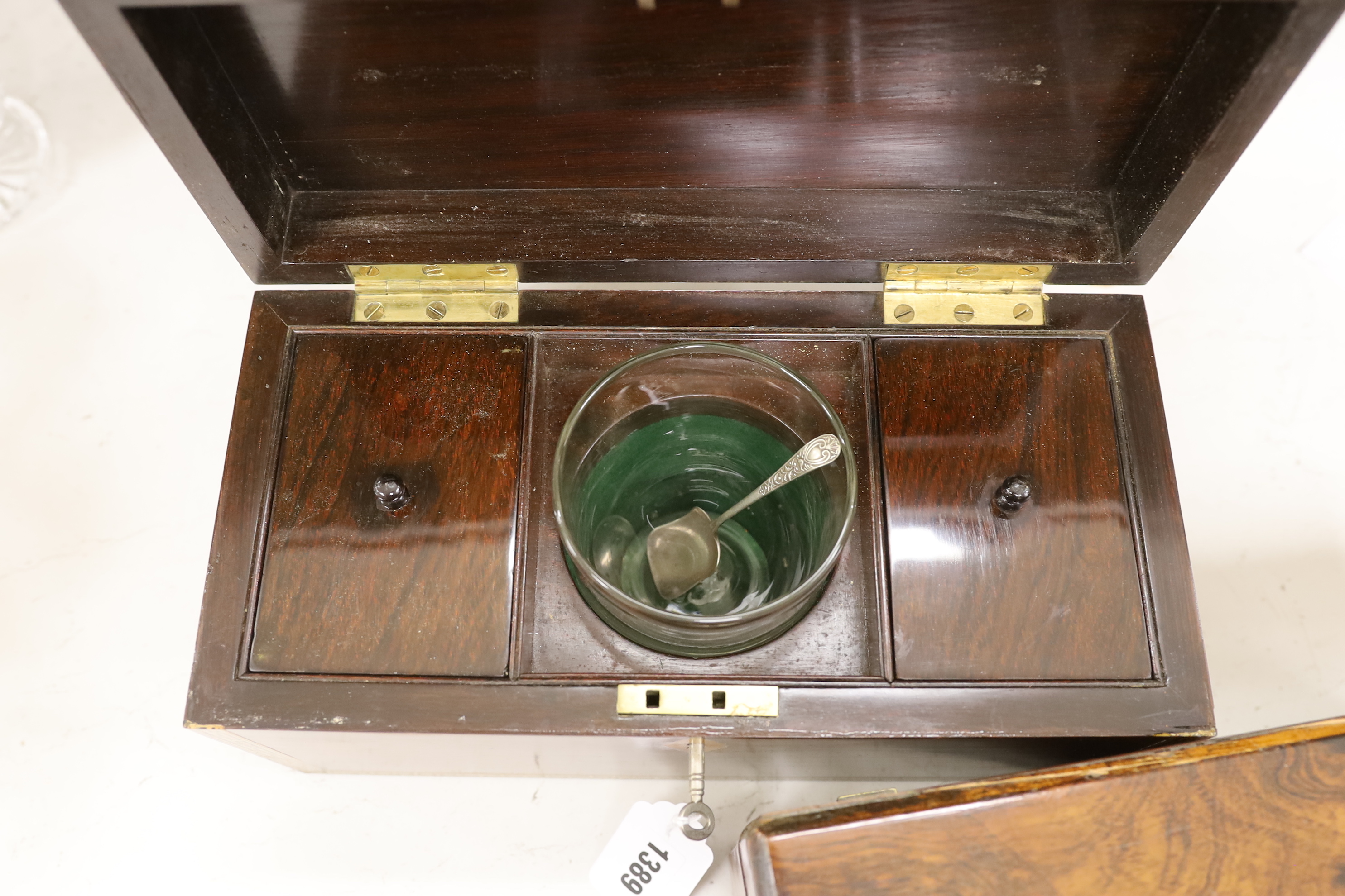 A Victorian rosewood tea caddy with ornate stringing and fitted interior and a mahogany tea caddy, interior missing, rosewood caddy 32.5cm wide, 17cm high